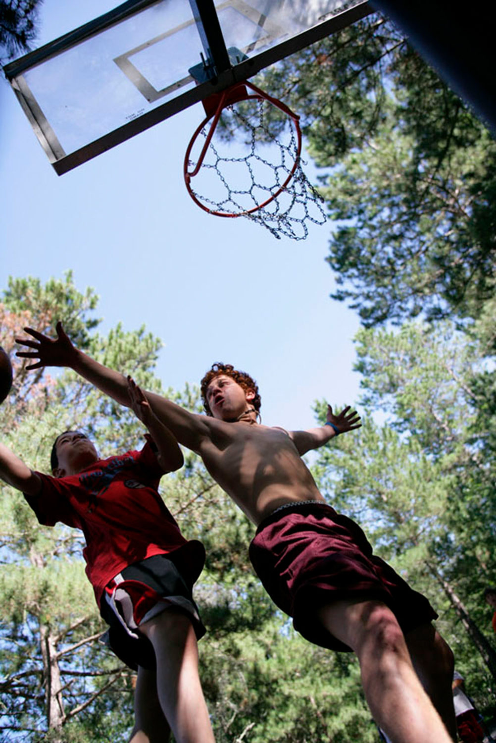 Boys playing basketball at Camp Thunderbird