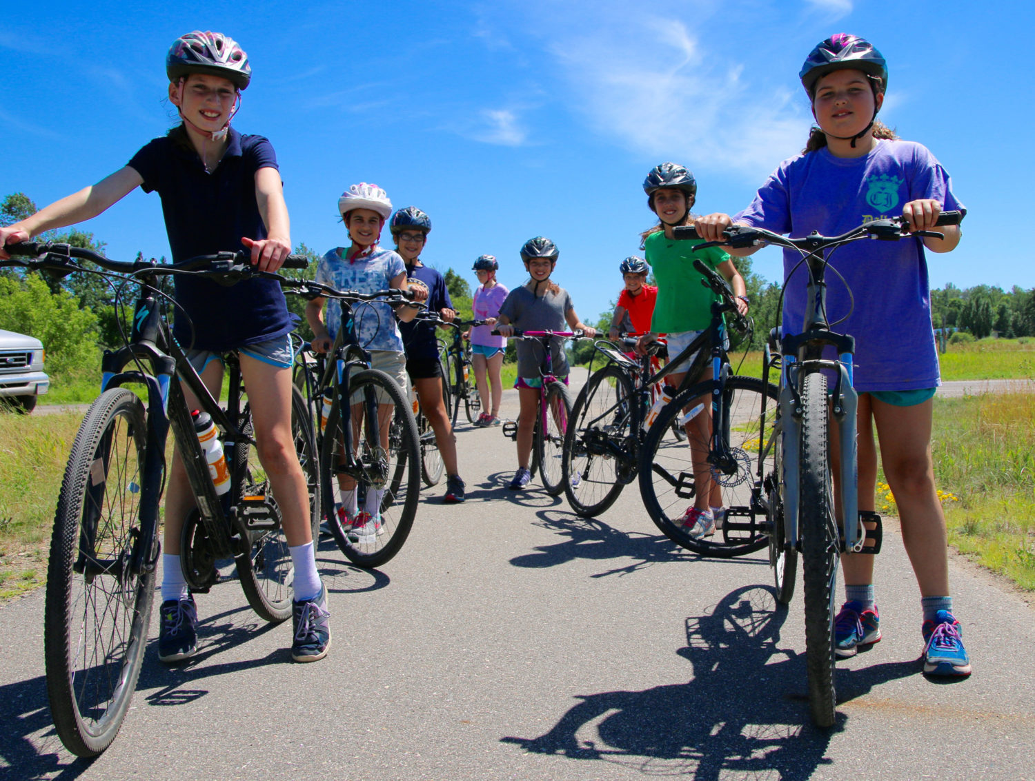 Kids biking together on a trail