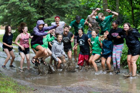 Kids jumping in puddles