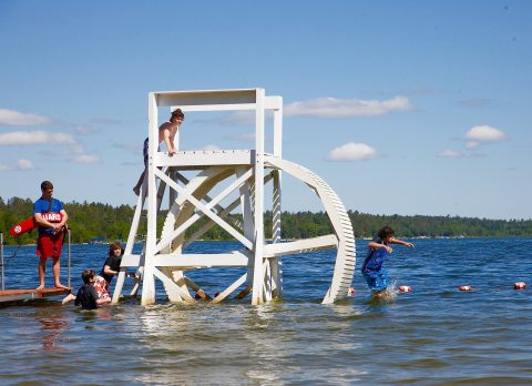 Children playing in the lake at Camp Thunderbird