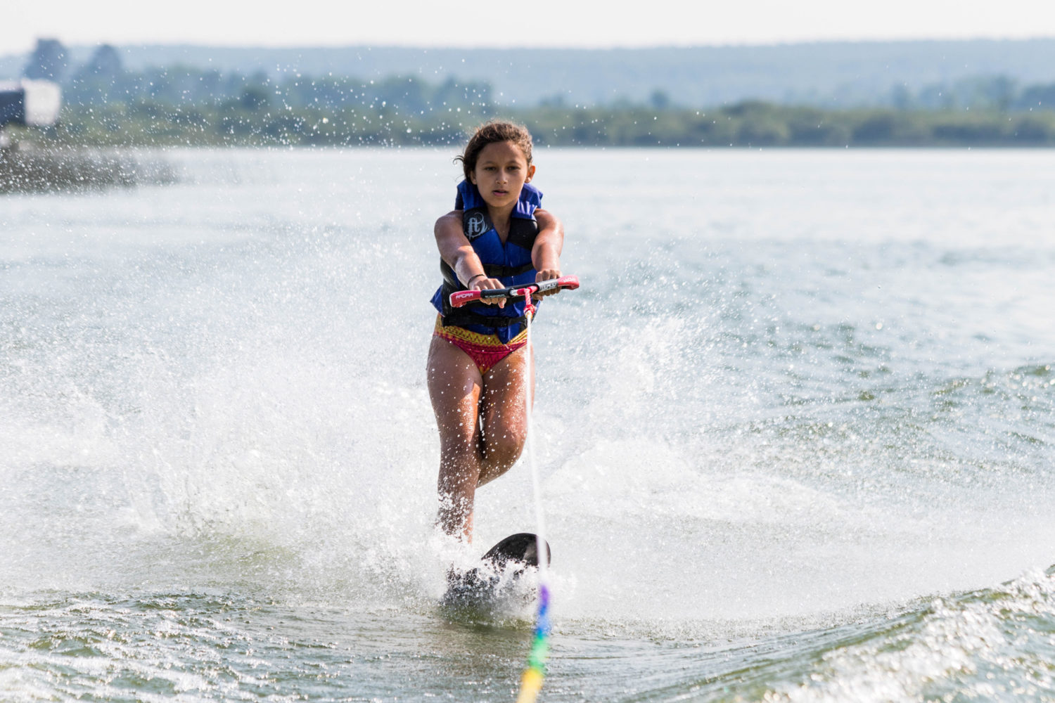 Girl water skiing on the lake